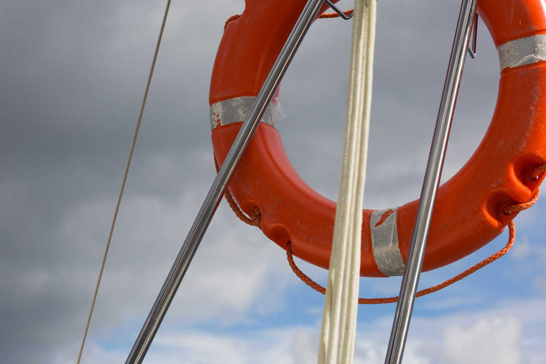 Lifebuoy hanging on back part of yacht