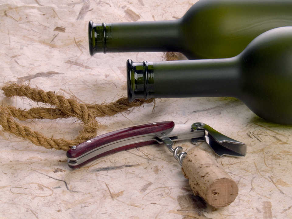 Close up vine botles and corkscrew