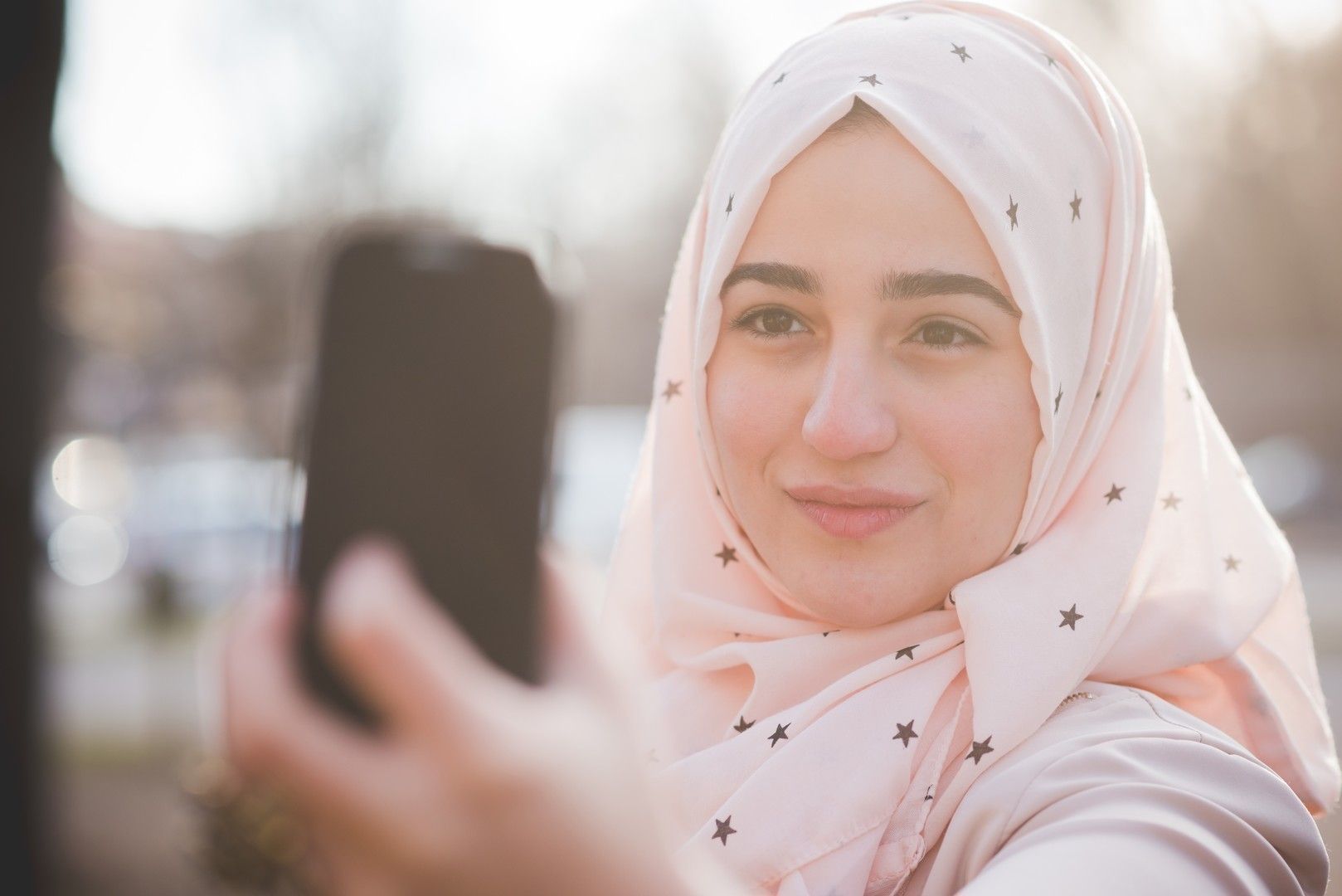 young beautiful muslim woman at the park
