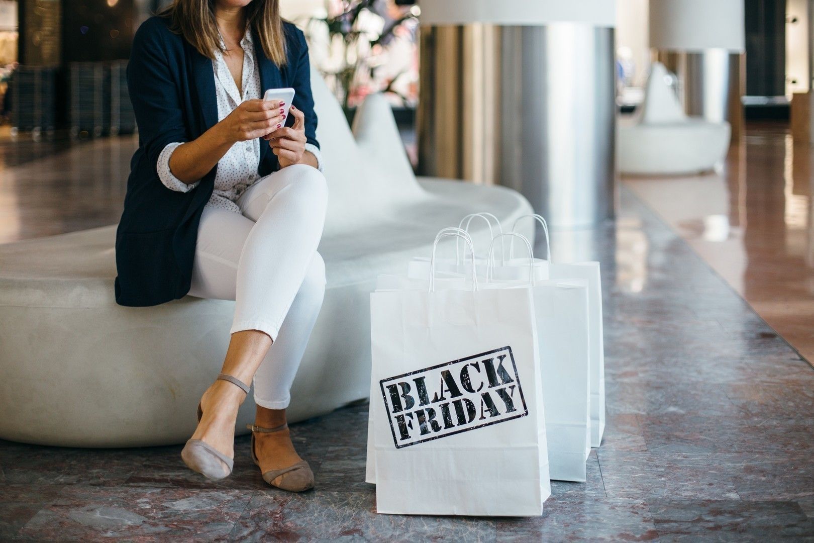 Woman with cell phone in mall