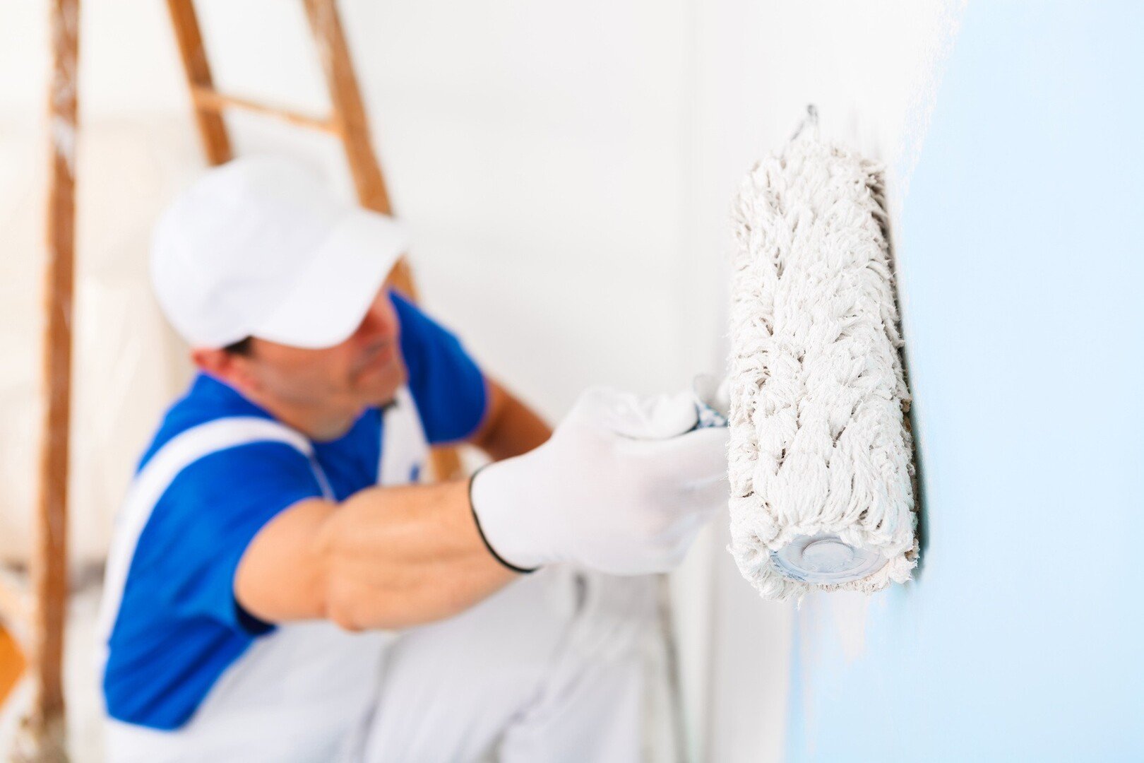 painter painting a wall with paint roller cf ffaabfcfafebe mv