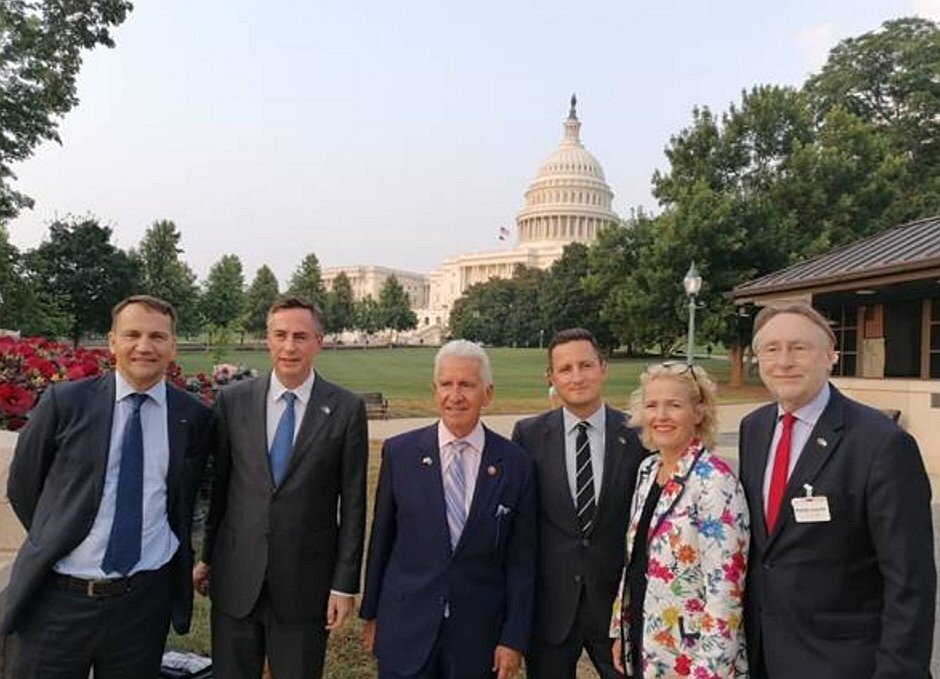 A group of people posing for a photoDescription automatically generated