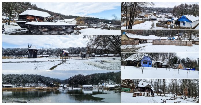 492 Muzeul ASTRA iarna, cu casele tradiționale și aleile acoperite de zăpadă, într-un peisaj de poveste.